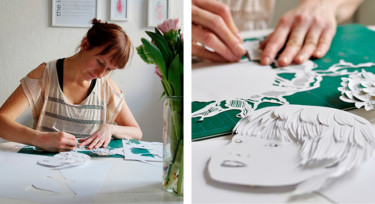 Kirsti Maula tekemässä taidetta paperileikkuutekniikalla.