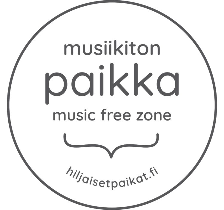 Musiikiton paikka -merkki. Ympyrän keskellä lukee "musiikiton paikka, music free zone" ja pienemmällä "hiljaisetpaikat.fi"
