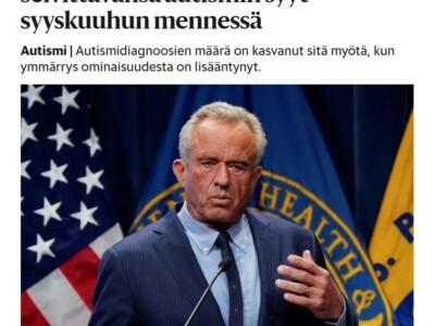 Uutiskuva, jossa Yhdysvalotjen terveysministeri Robert F. Kennedy, taustalla viralliset liput.
