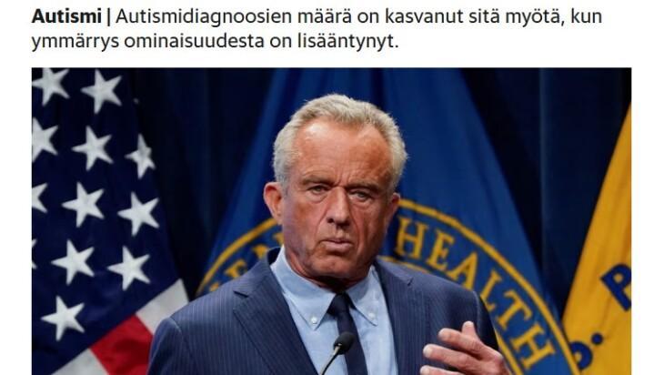 Uutiskuva, jossa Yhdysvalotjen terveysministeri Robert F. Kennedy, taustalla viralliset liput.